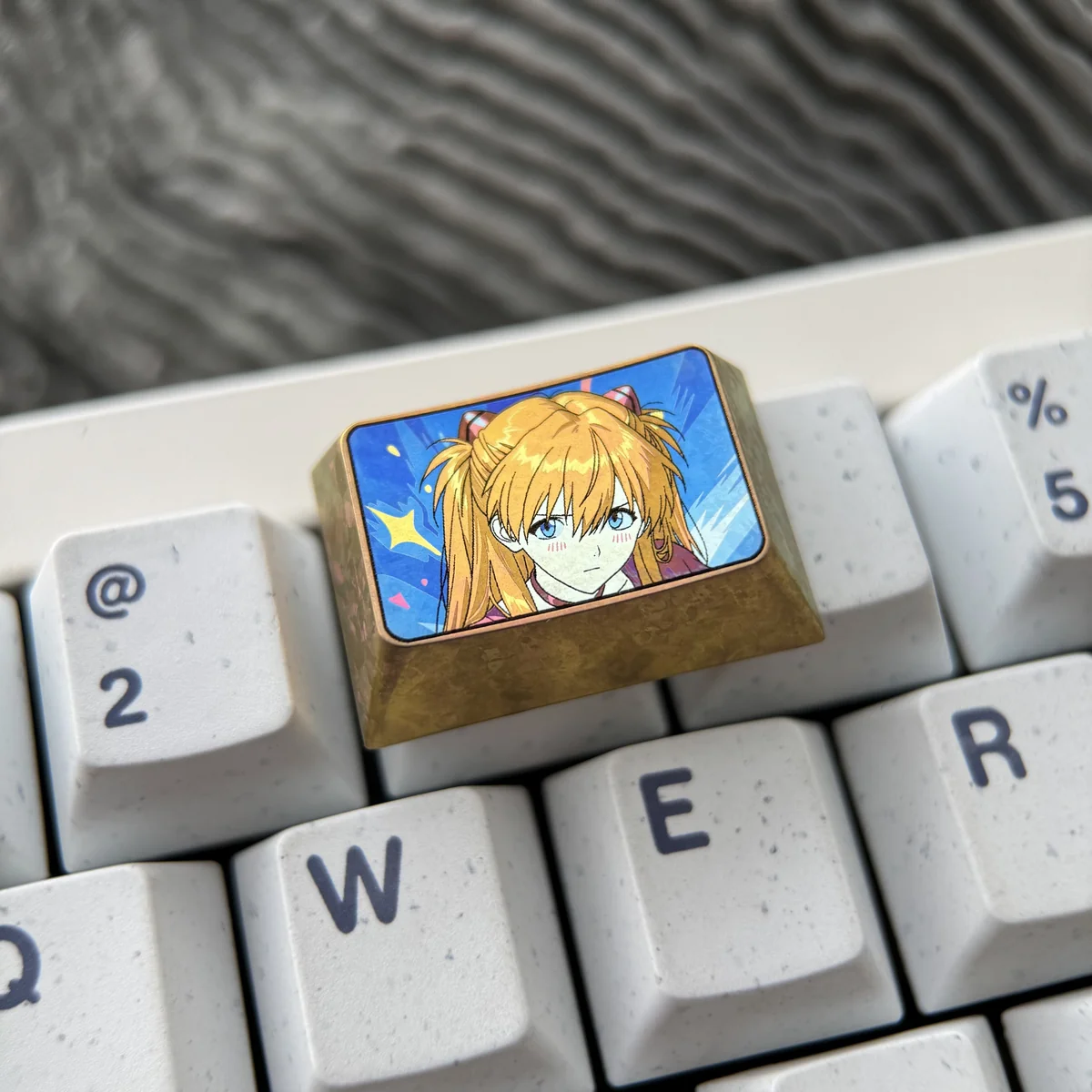 Detailed view of CNC-machined titanium keycap texture