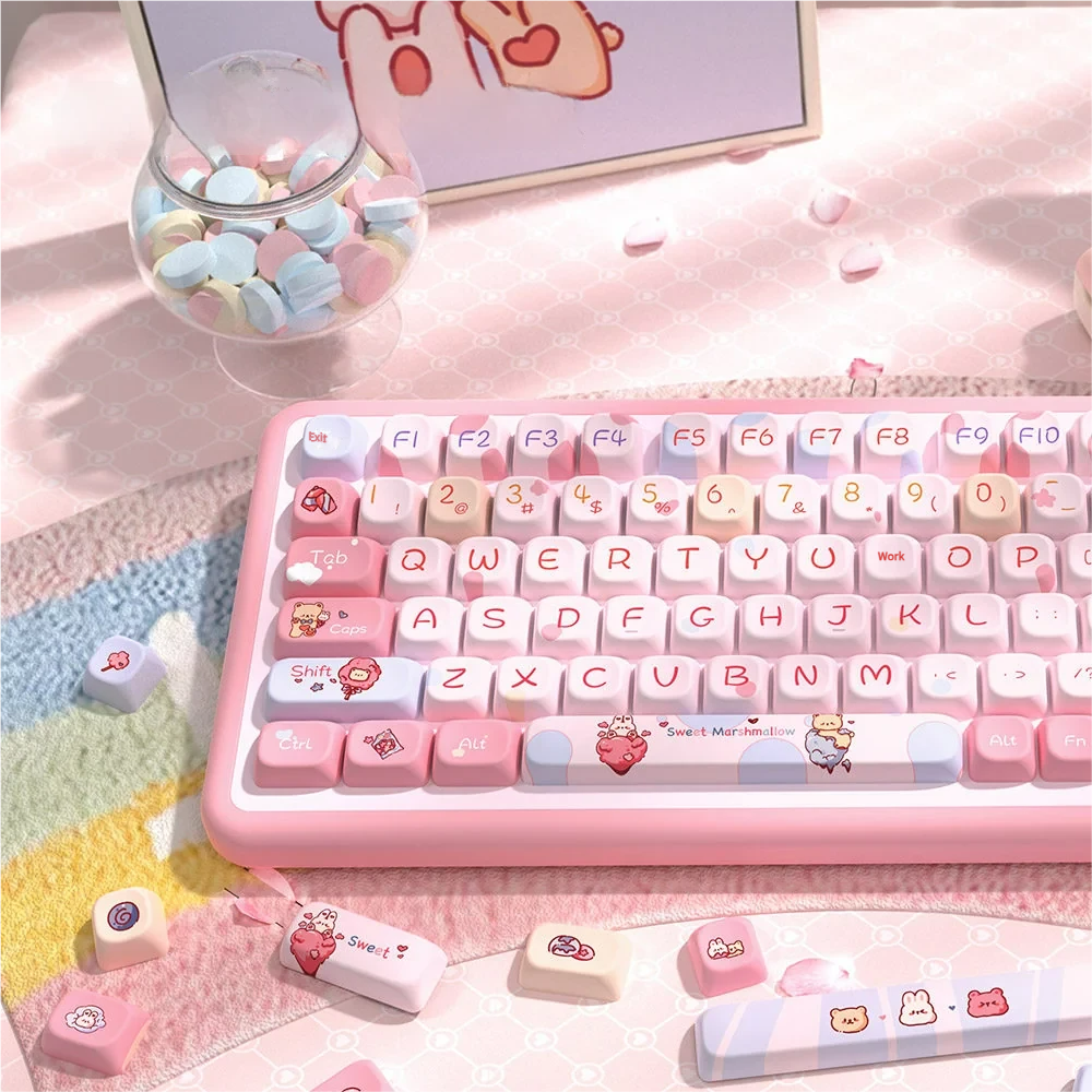 Detail shot of a few Cotton Candy Dream keycaps, emphasizing the ethereal cloud and candy-inspired artistry.