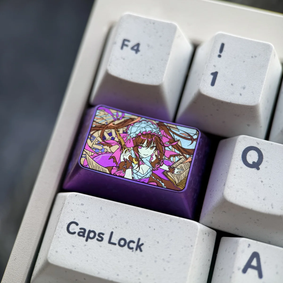 Close-up of the Kurumi Tokisaki titanium keycap, highlighting the sleek finish and gothic elegance.