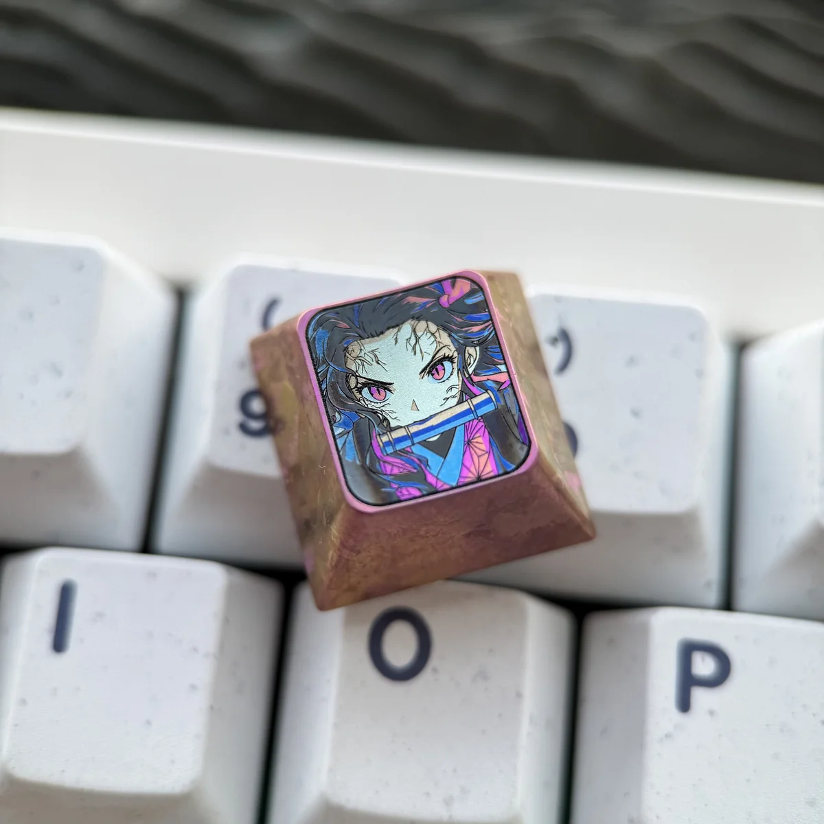 Demon Slayer Nezuko Kamado keycap installed on an MX-style switch, glowing with backlit keyboard RGB.