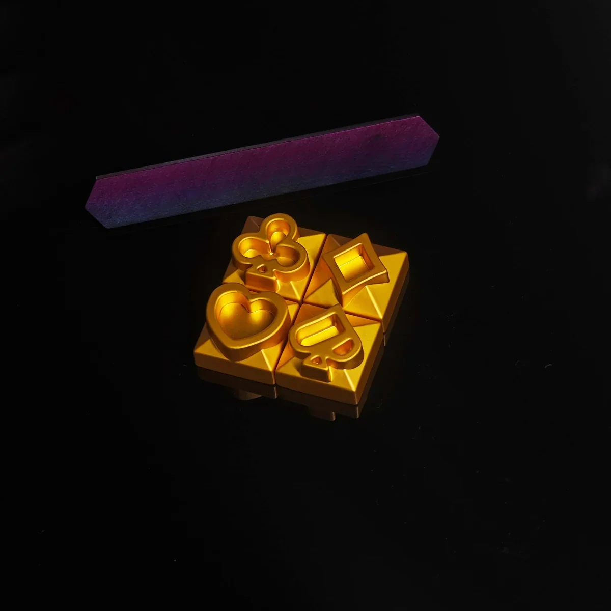 Lifestyle shot of the Poker Suits Keycap enhancing a gaming desk setup.