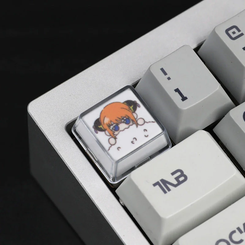Close-up of Gintama artisan resin keycap set showing detailed character art