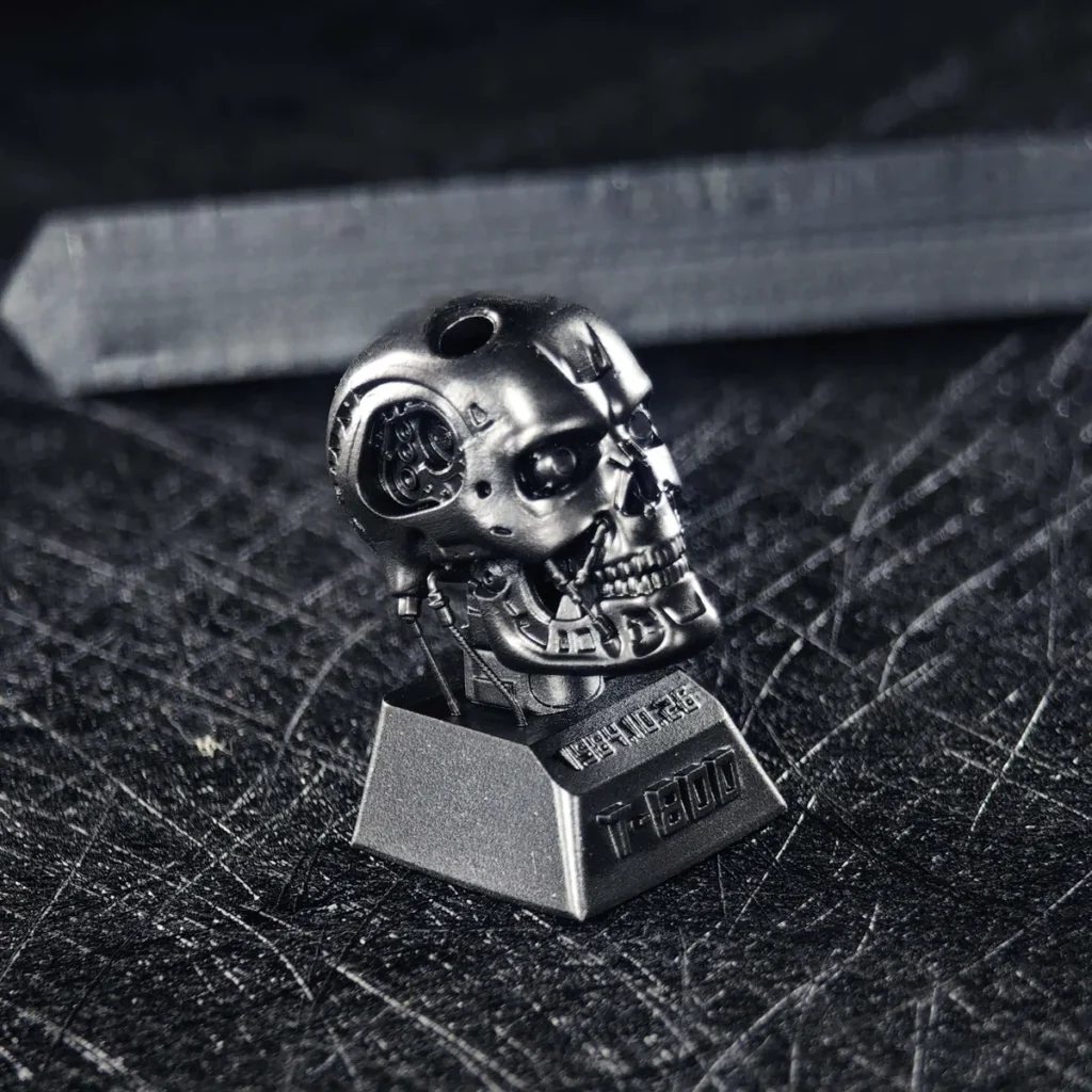 Terminator T-800 keycap in hand, highlighting size and texture