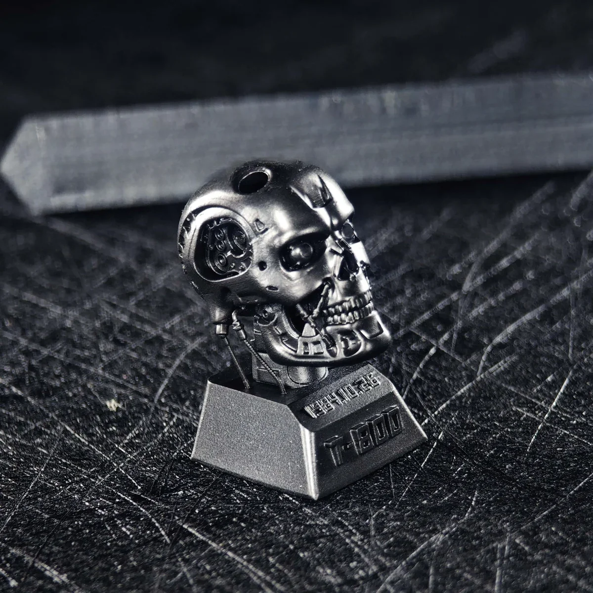 Terminator T-800 keycap in hand, highlighting size and texture