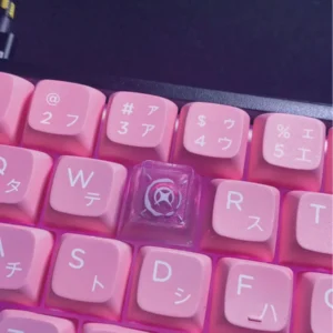 Artisan's hand holding the Valorant Reyna keycap, highlighting its unique craft
