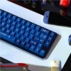 Close-up of Interstellar Journey keycaps showing cosmic designs