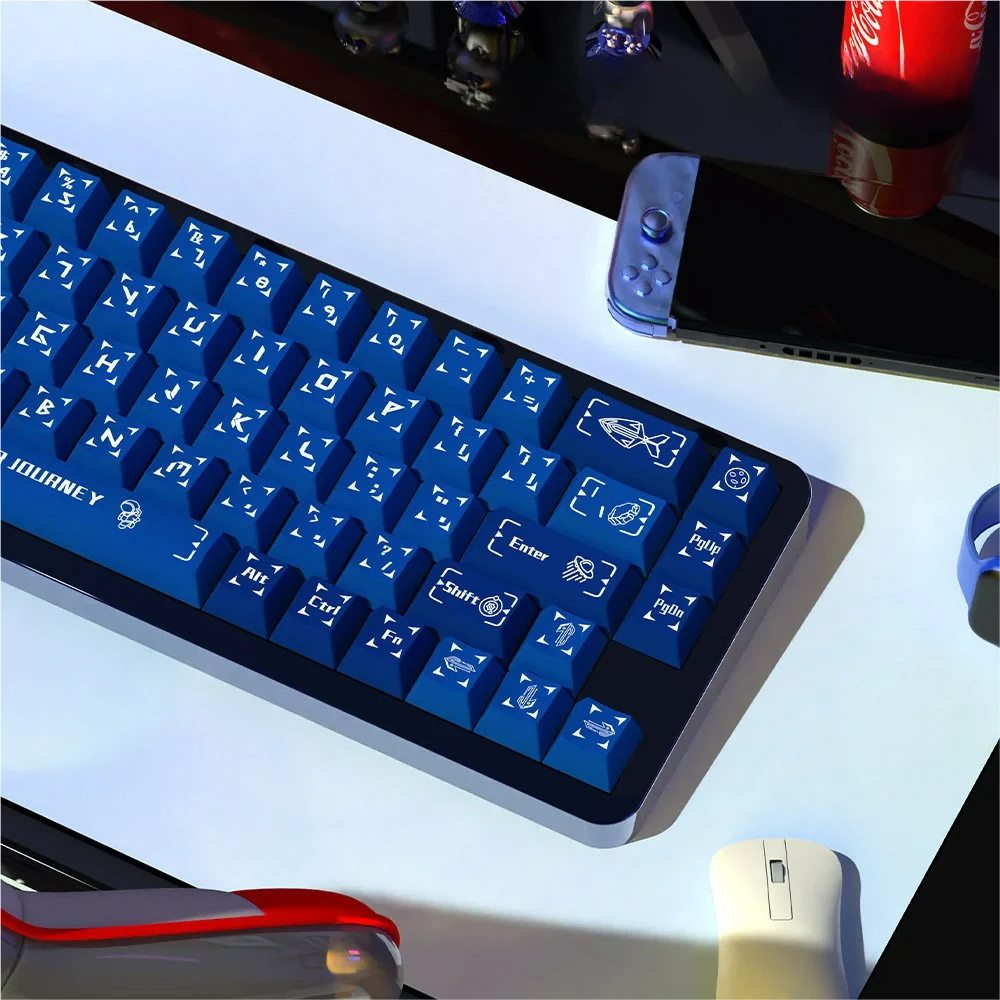 Close-up of Interstellar Journey keycaps showing cosmic designs