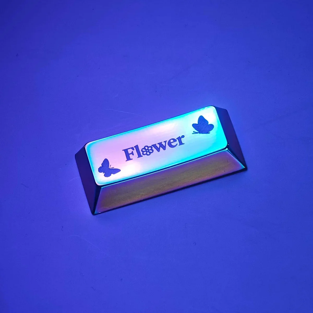 Detailed shot of the metallic finish and etched patterns on the nature butterfly keycap