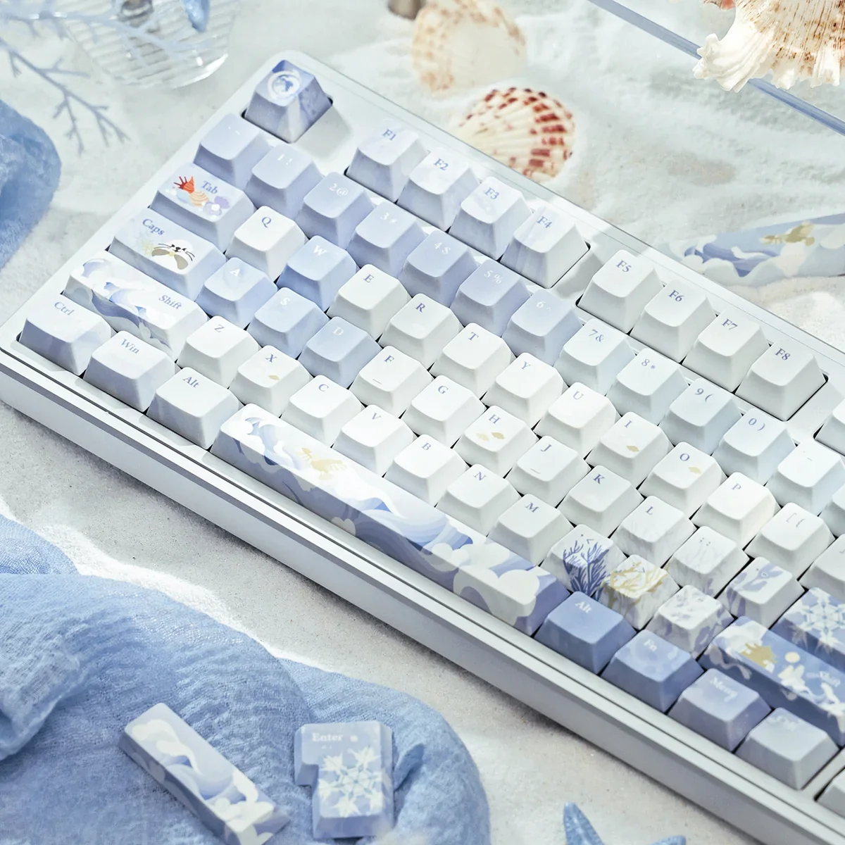 Close-up of JX3 Penglai keycaps, highlighting vibrant blue hues and flowing motifs.