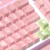 Side profile view of Lily of the Valley Cherry profile keycaps, illustrating their ergonomic sculpting