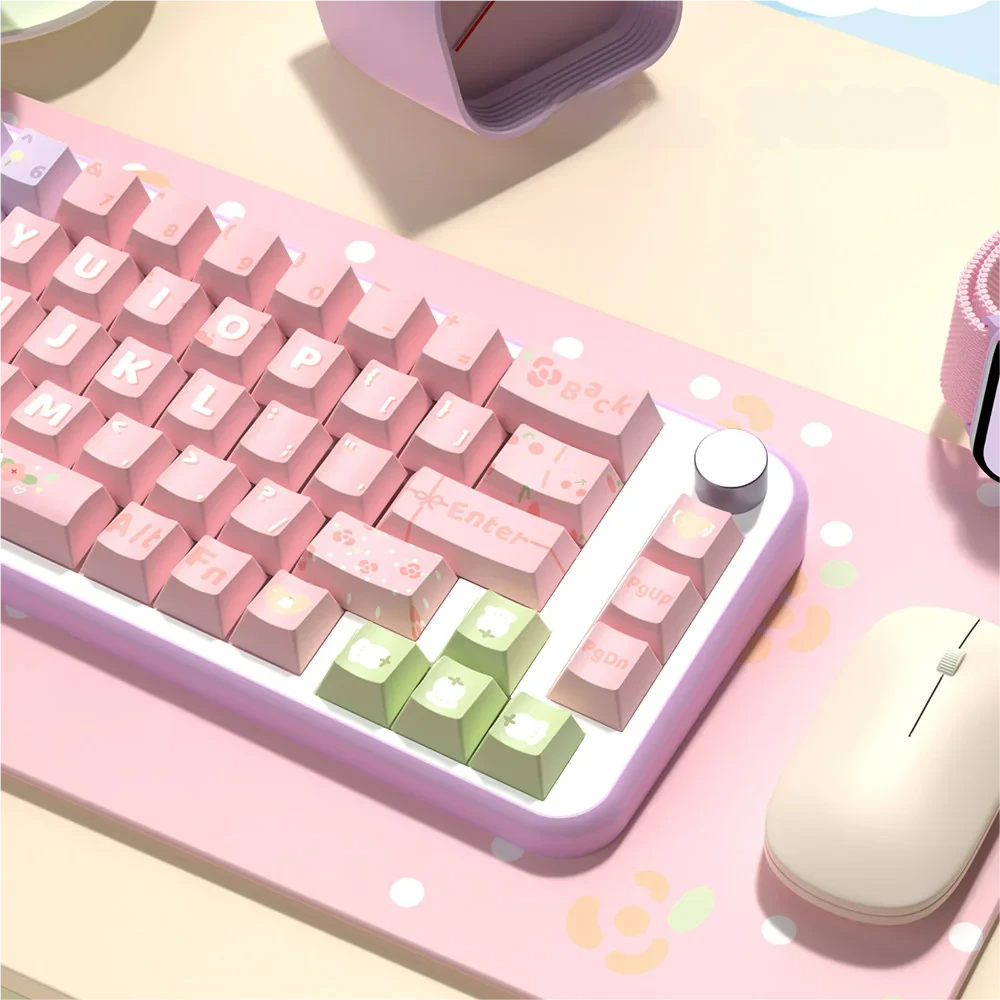 Individual Lily of the Valley keycaps arranged, showing intricate purple, pink, and green floral designs