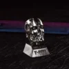 T-800 keycap from an elevated angle, showcasing metallic finish