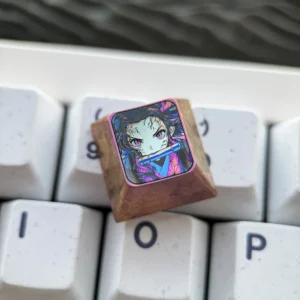 Nezuko Kamado artisan keycap handcrafted from titanium, showcasing intricate details on a mechanical keyboard.