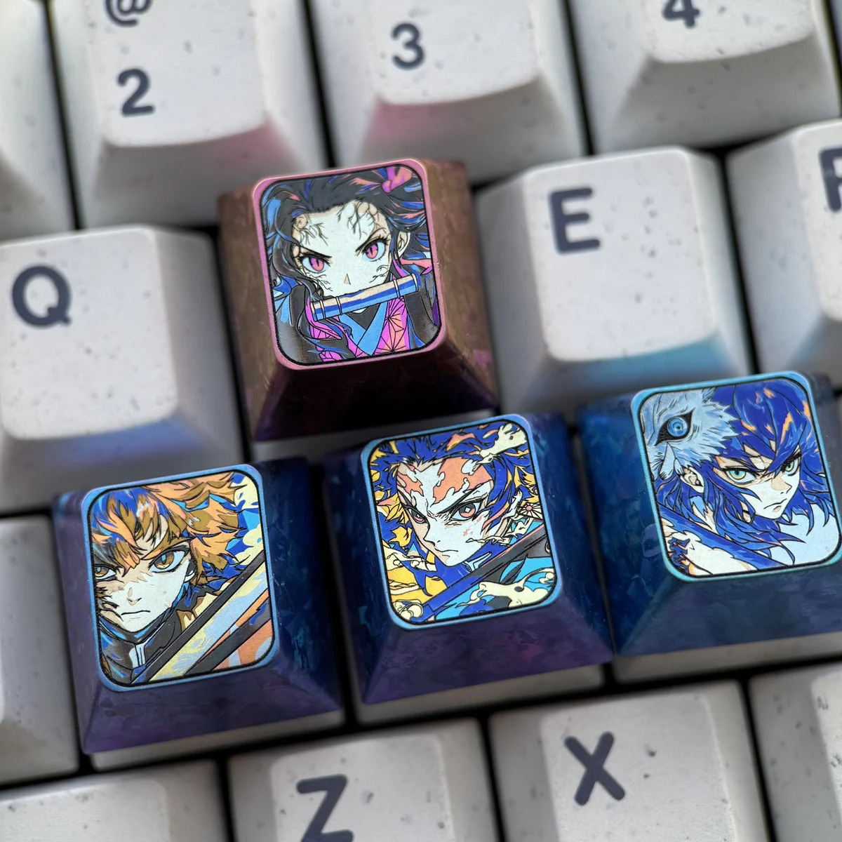 Close-up of premium titanium Nezuko Kamado keycap, highlighting the anodized finish and craftsmanship.