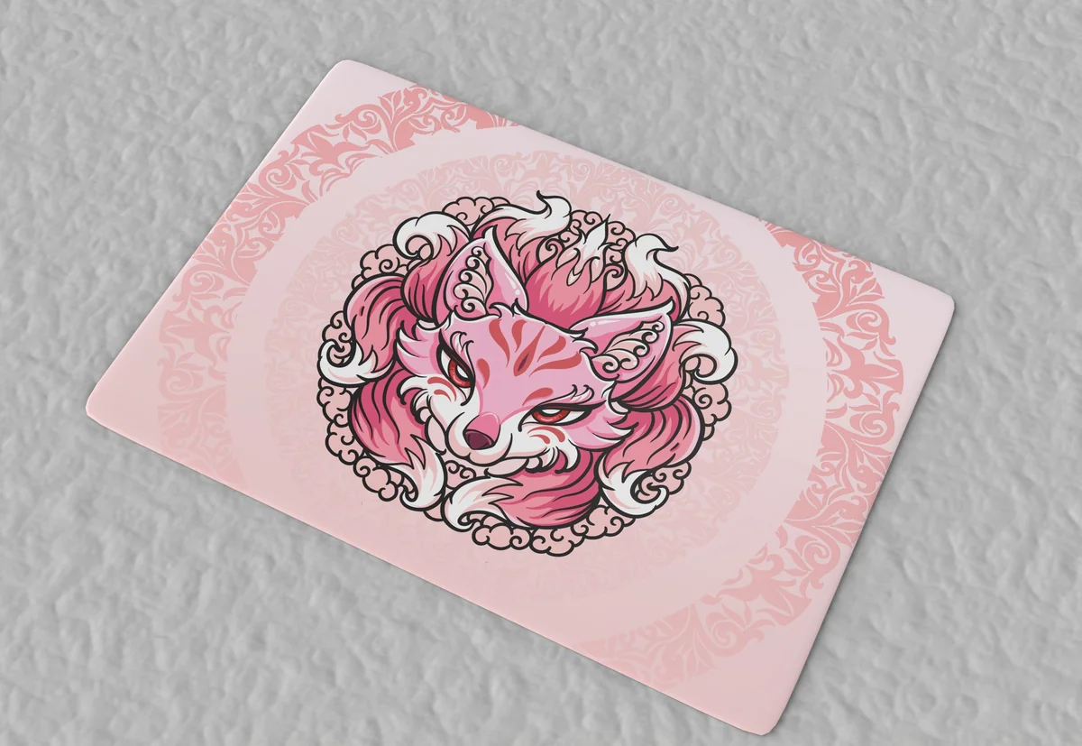 Ethereal Nine-tailed Fox design glowing on a dark desk surface