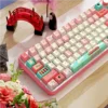Close-up of Spirited Away keycaps, featuring No-Face and soot sprites on a keyboard
