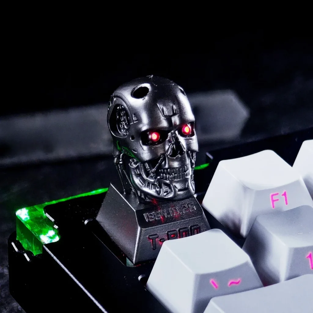 Collection of T-800 keycaps in different lighting conditions
