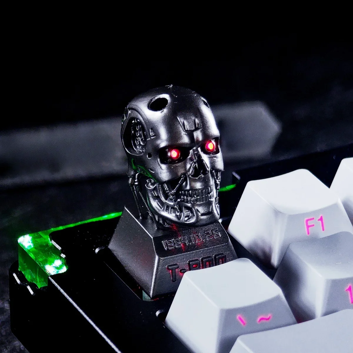 Collection of T-800 keycaps in different lighting conditions