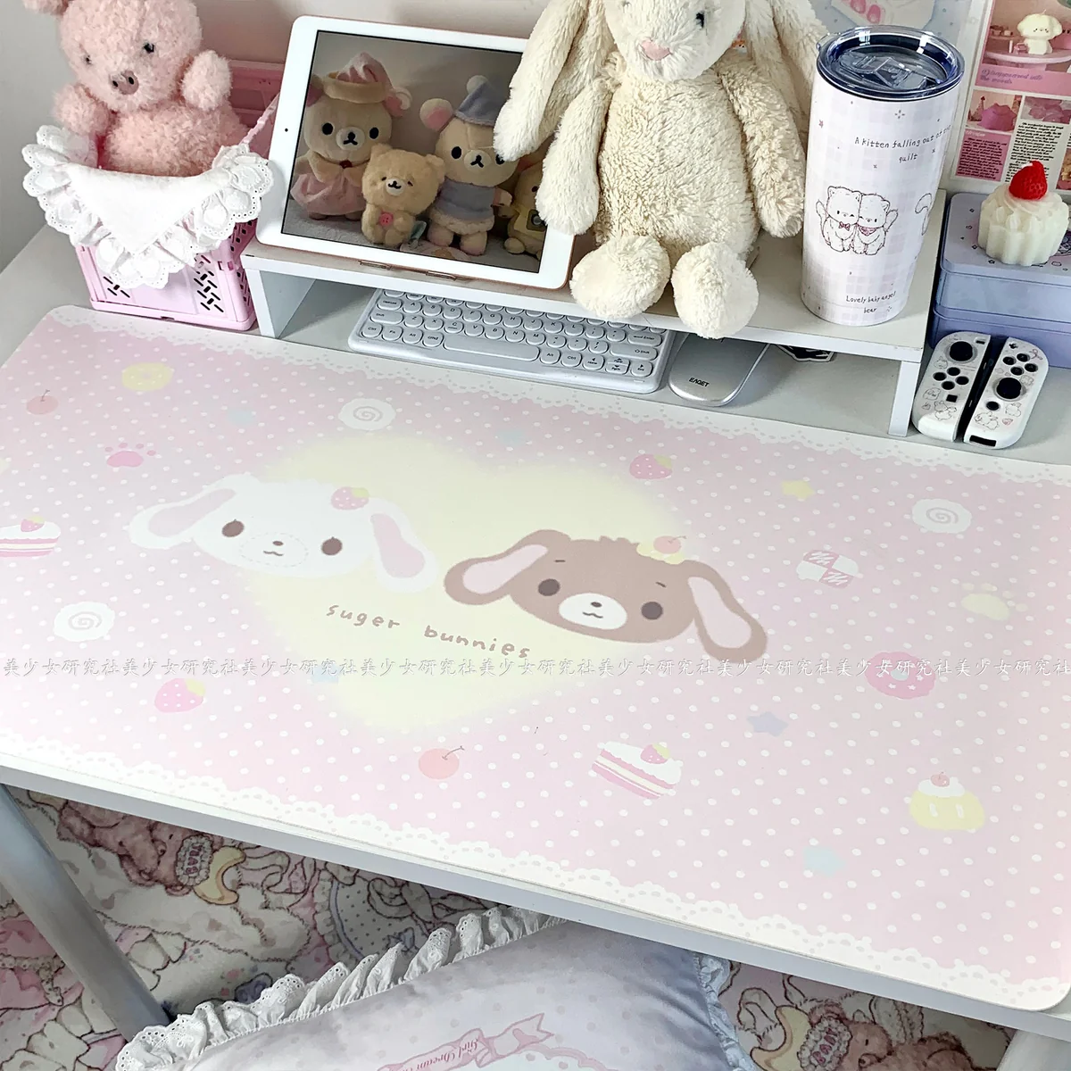 Detail shot of the smooth surface and stitched edges of the Sugarbunnies Dessert Desk Mat