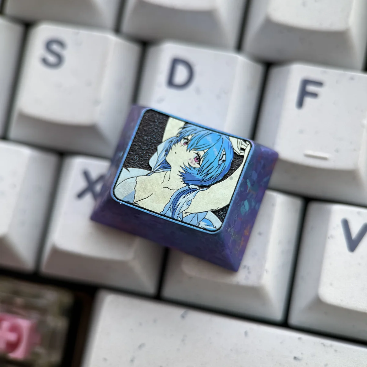 Close-up of the keycap's MX stem compatibility, showing durable titanium construction.