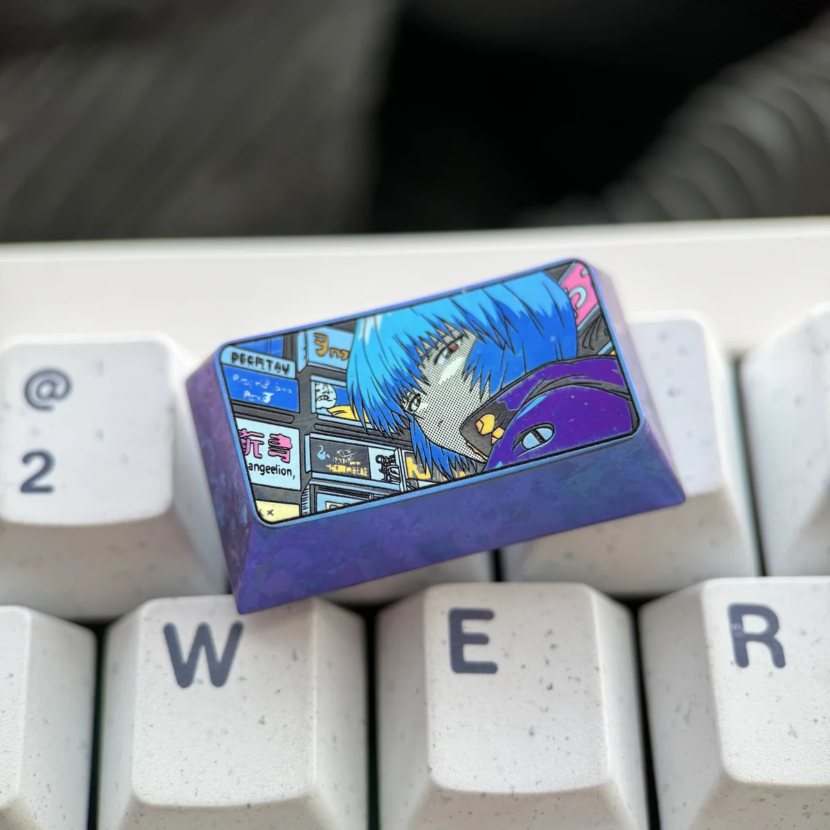 Rei Ayanami titanium keycap in packaging, emphasizing premium quality