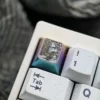 Collection of artisan keycaps including Saber, on a gaming keyboard setup
