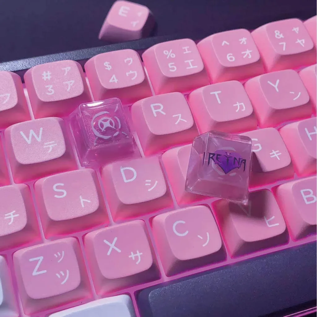 Close-up of handcrafted Valorant Reyna artisan keycap from an angled view