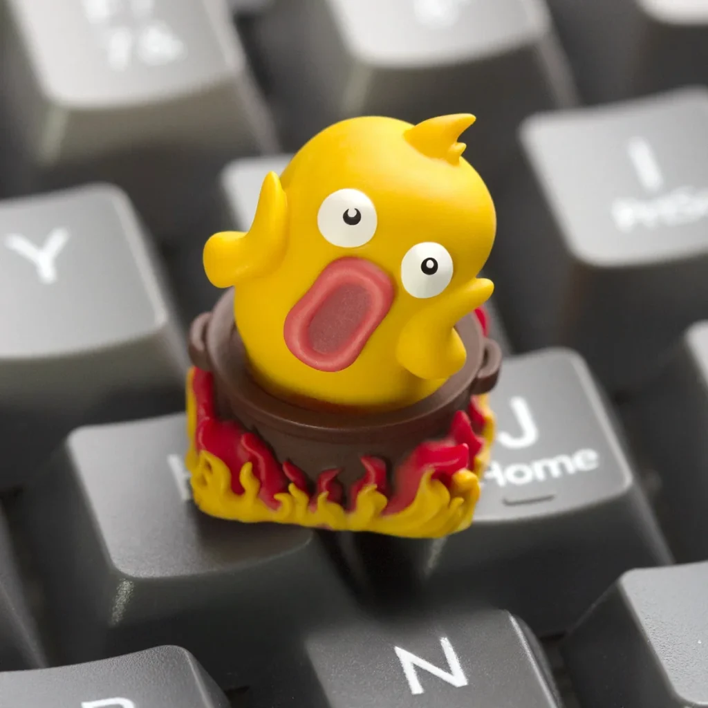 Side profile of the Hotpot Duck ESC Keycap showcasing its unique design