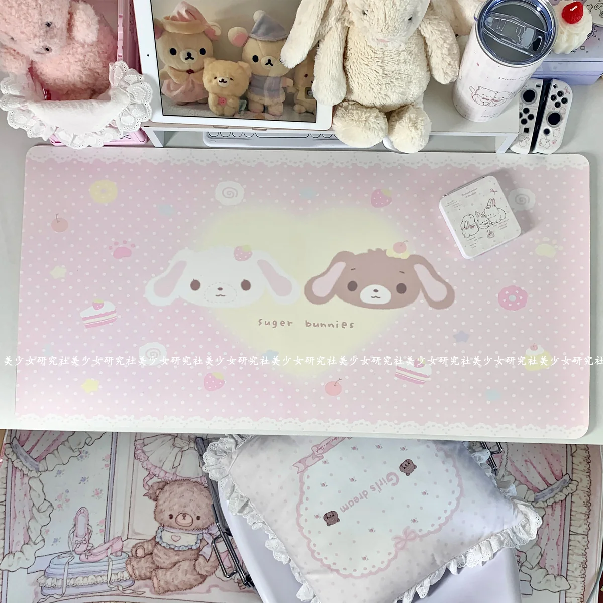 Overhead view of the desk mat showcasing the full whimsical dessert and bunny motif