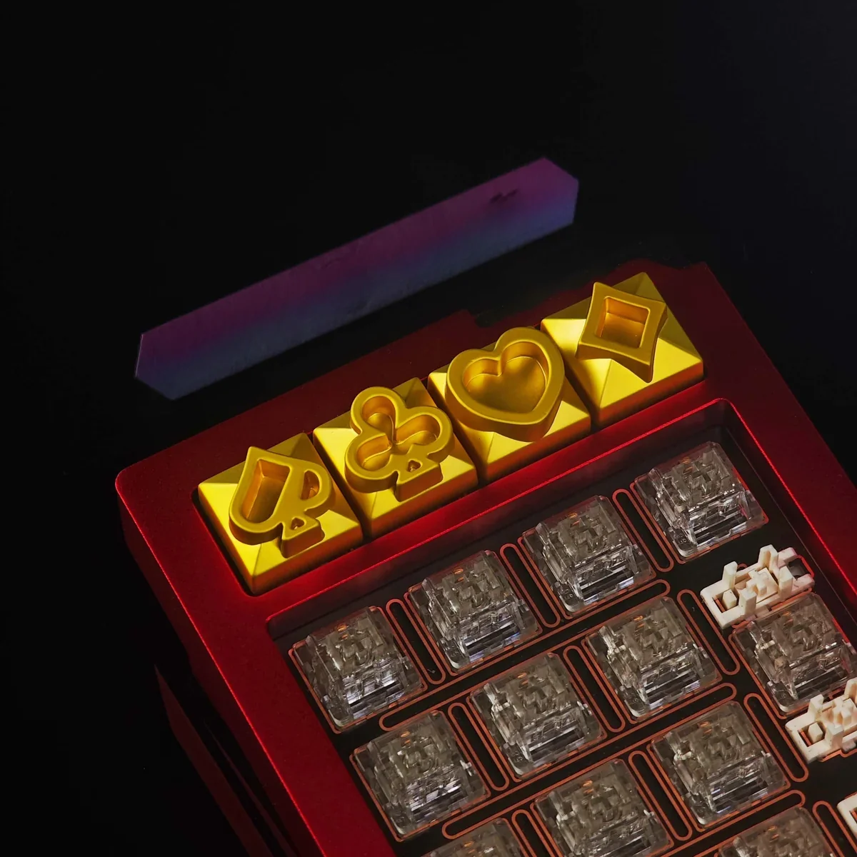 Angled view of the durable zinc alloy Poker Suits Keycap highlighting its metallic finish.