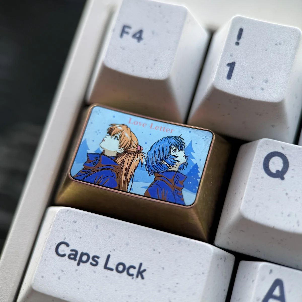 Close-up of Asuka Langley Soryu design on titanium keycap