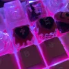 Close-up of a handcrafted resin blackberry cookie keycap with intricate details