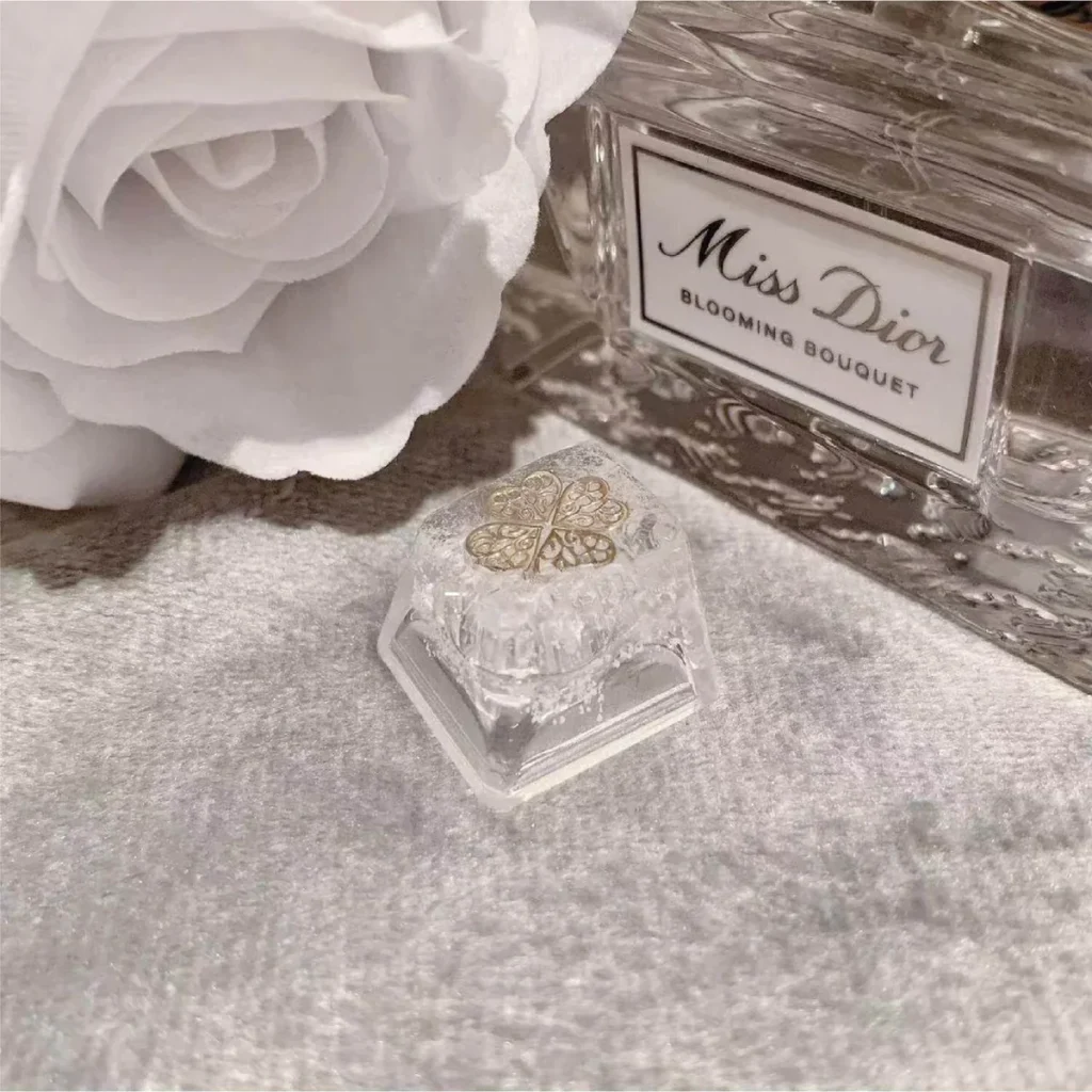 Detailed view of handcrafted resin butterfly and window diorama in keycap