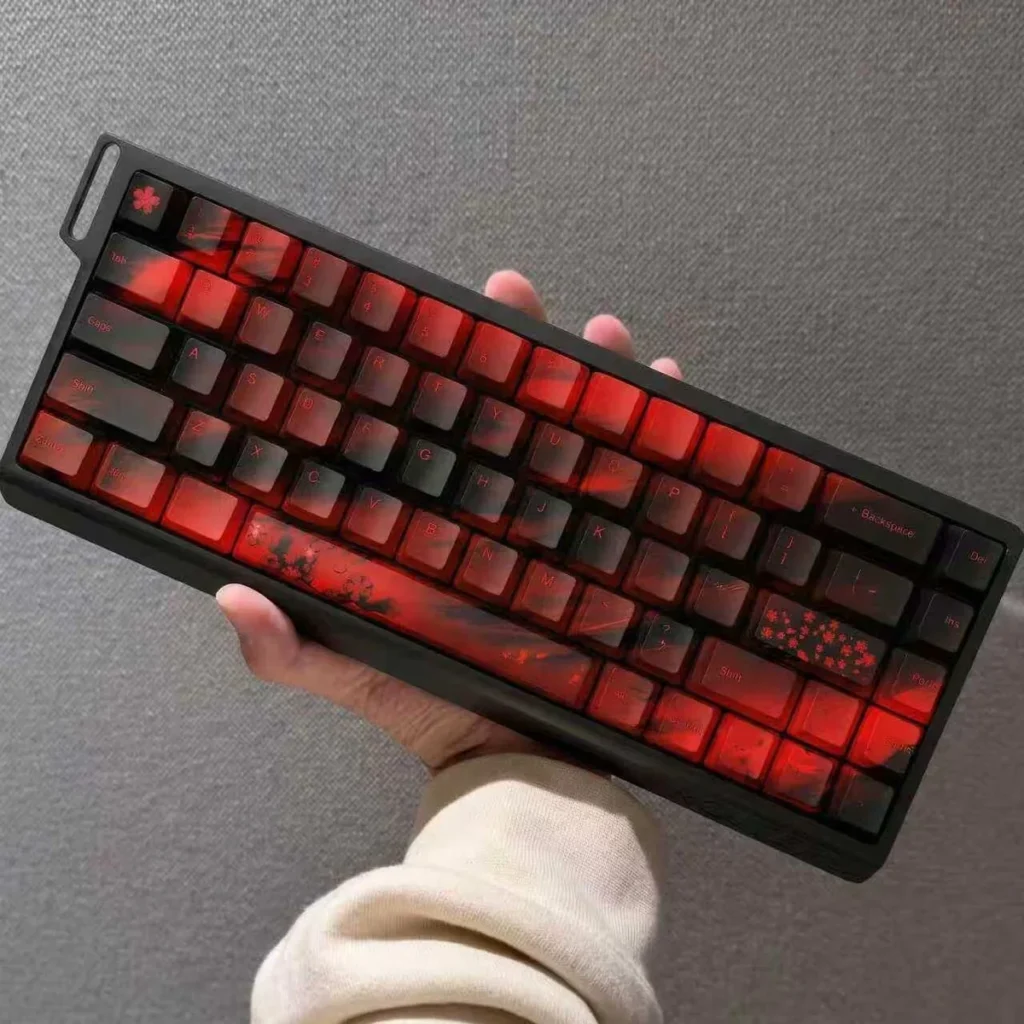 Detail shot of additional novelty keycaps from the Cherry Blossom set, featuring unique floral accents.