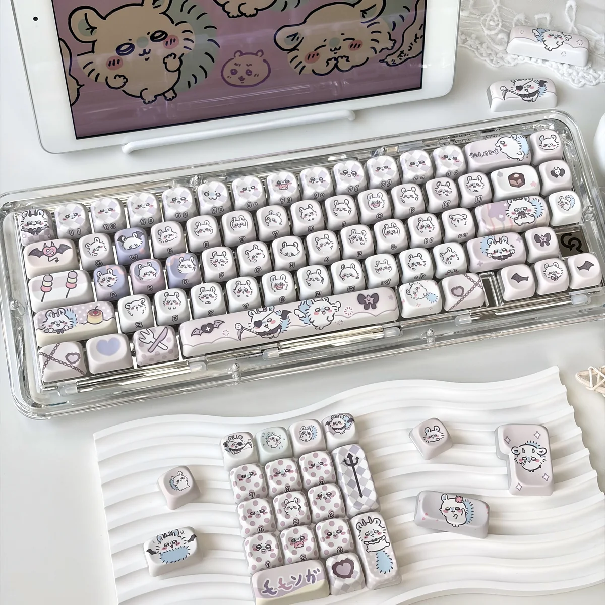 Close-up of Chiikawa Momonga keycaps showing side-printed translucent legends