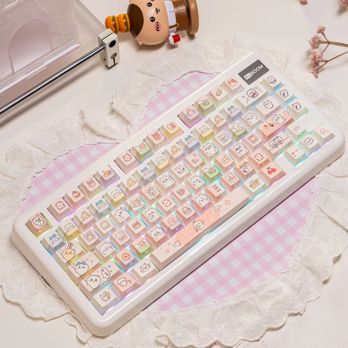 Close-up of Chiikawa character keycaps with RGB lighting glowing through