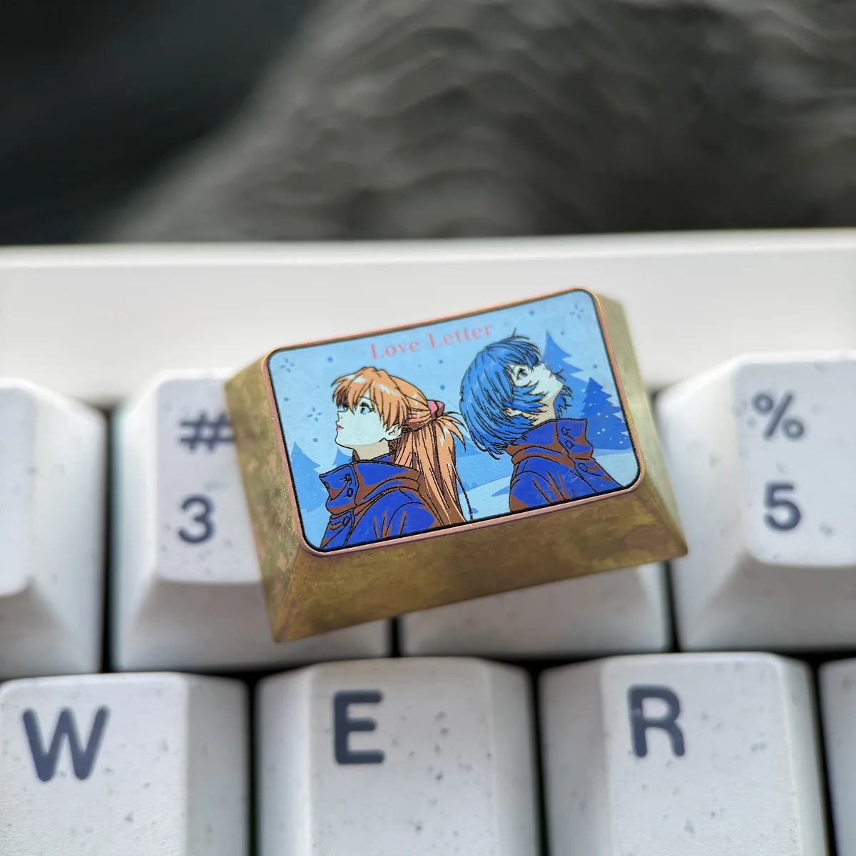 Side view of Evangelion titanium keycap showcasing profile