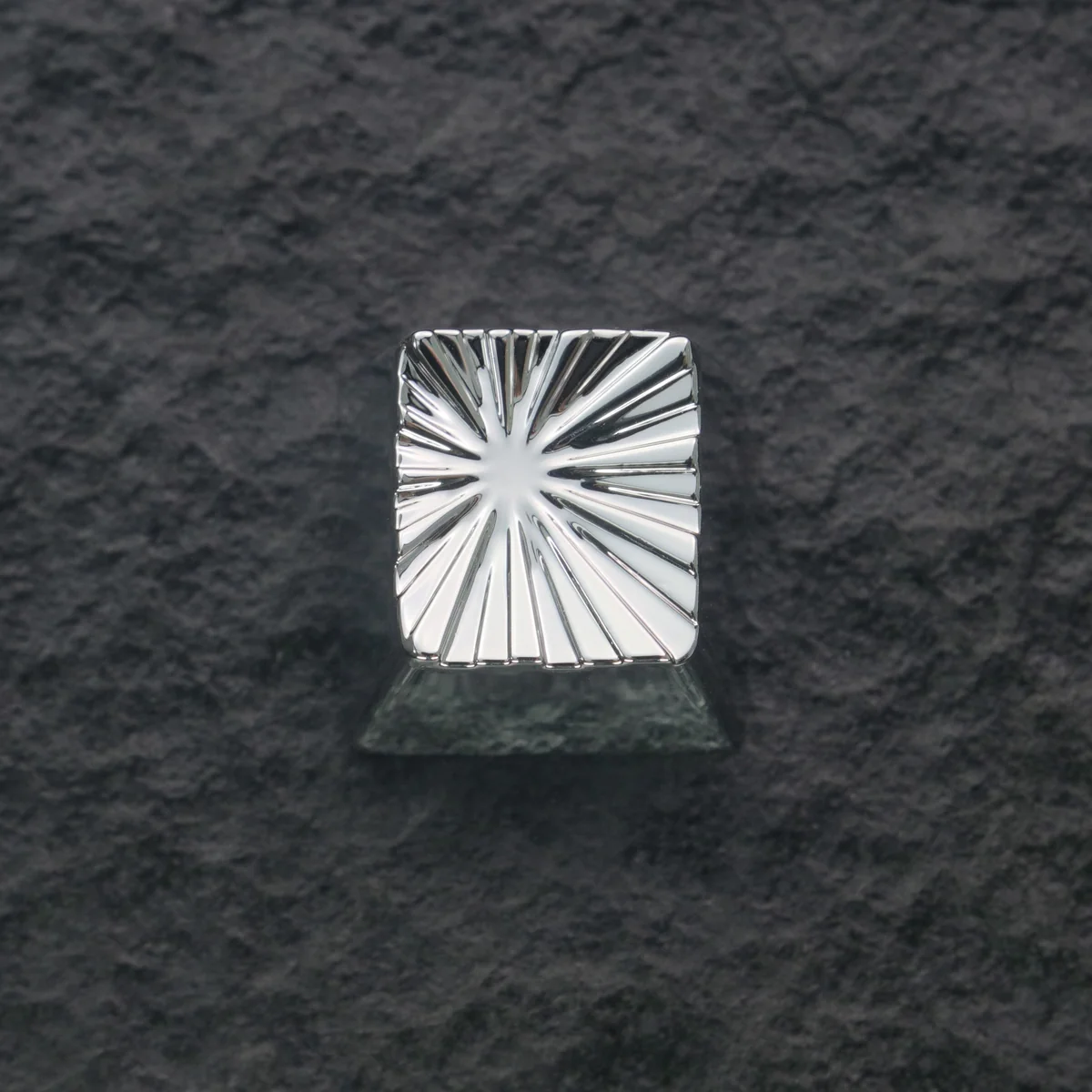 Hand holding the Explosion Keycap, emphasizing its premium weight and intricate design