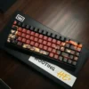 Fiery Abyss PBT keycap set with vibrant Japanese Kanji and character art on a mechanical keyboard.
