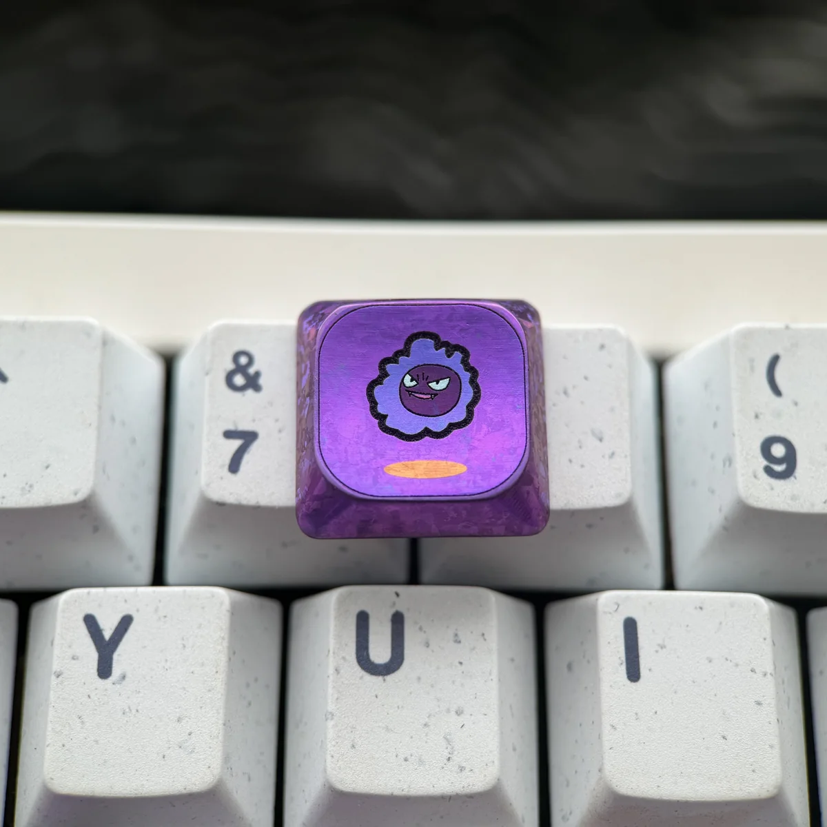 Side view of the Gengar low-profile keycap, highlighting its sleek height