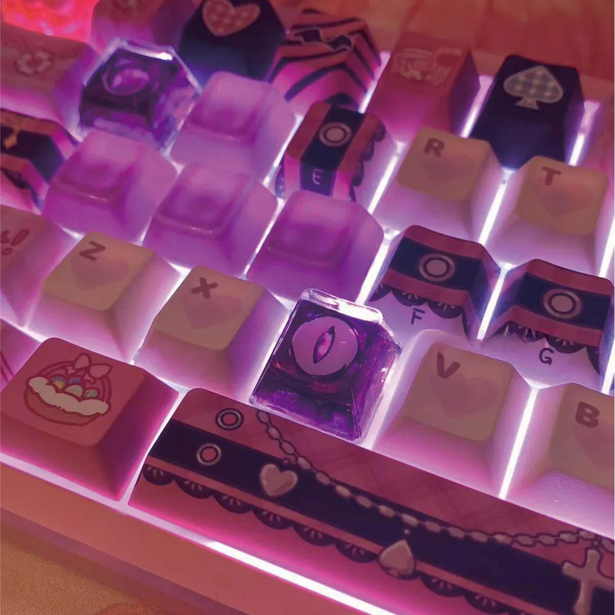 Close-up of handcrafted resin Valorant Reyna keycap details