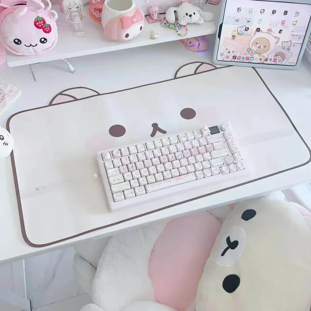 Kawaii Rilakkuma themed desk mat with pastel background on gaming setup