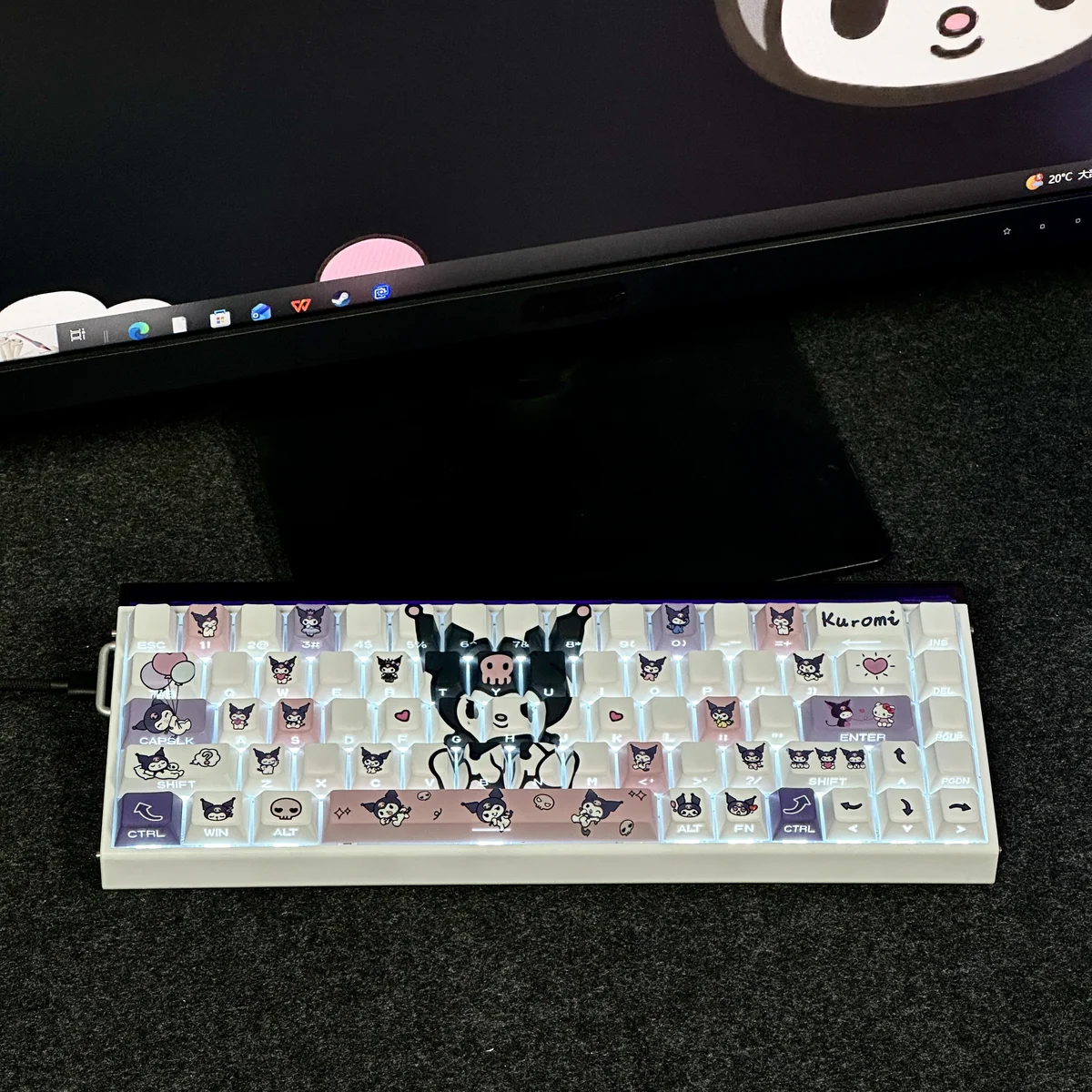 Close-up of translucent Kuromi keycaps showcasing side-engraved legends and RGB lighting