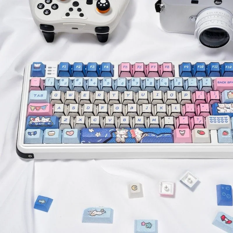 Full layout of 128 Manga Kitten PBT dye-sub keycaps spread out