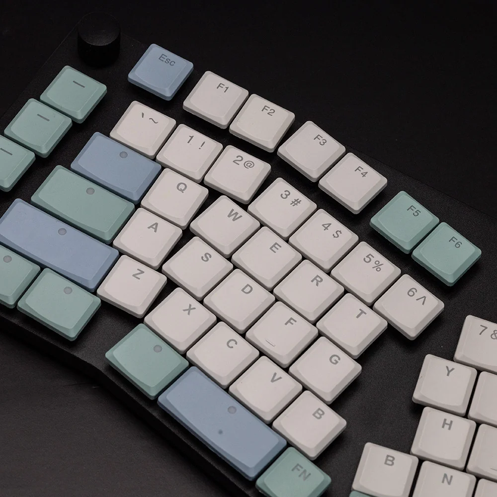 Ergonomic low-profile keycaps made from durable PBT material, designed for Choc V1