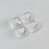 Overhead shot of the Pink Butterfly Heart WASD keycap set, arranged on a desk with a whimsical background