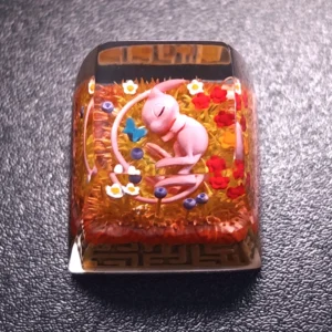 Close-up of Pokemon Mew Transparent Keycaps Exquisite artisan highlighting details and finish