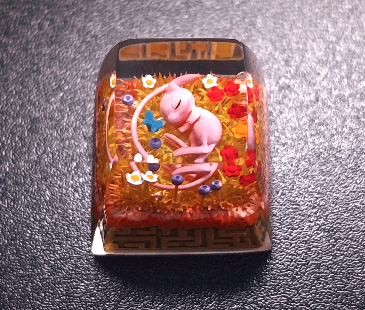 Close-up of Pokemon Mew Transparent Keycaps Exquisite artisan highlighting details and finish