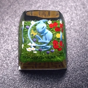 Side profile of Pokemon Mew Transparent Keycaps Exquisite artisan showing artisan keycap shape and fit