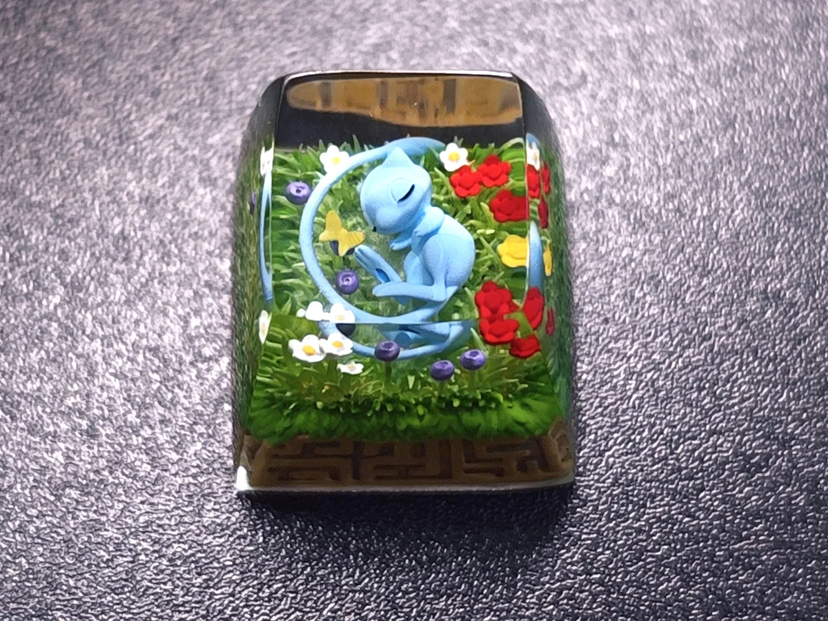 Side profile of Pokemon Mew Transparent Keycaps Exquisite artisan showing artisan keycap shape and fit